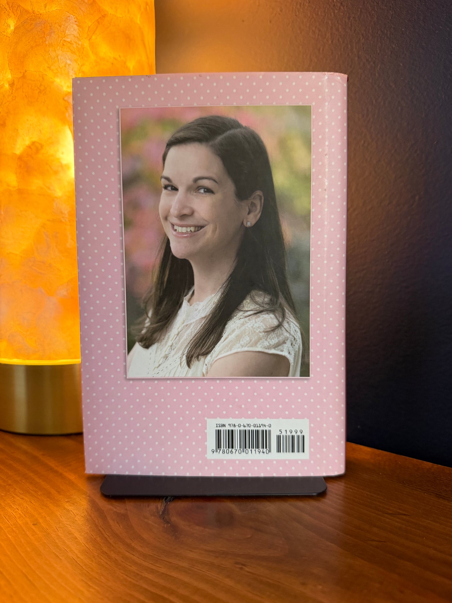 Rectangular photo frame with a portrait of a woman on a wooden surface