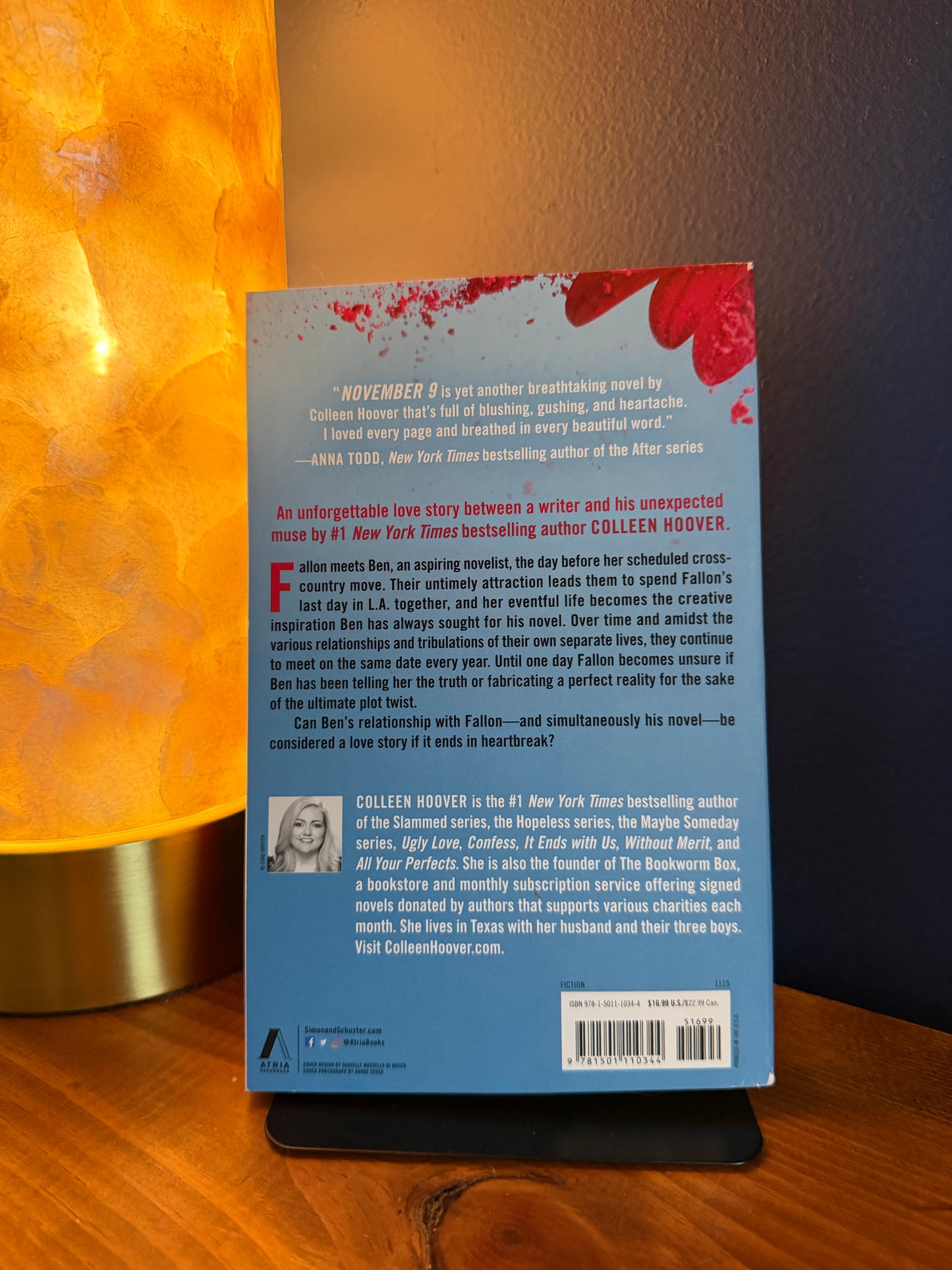Book cover with text on a wooden surface
