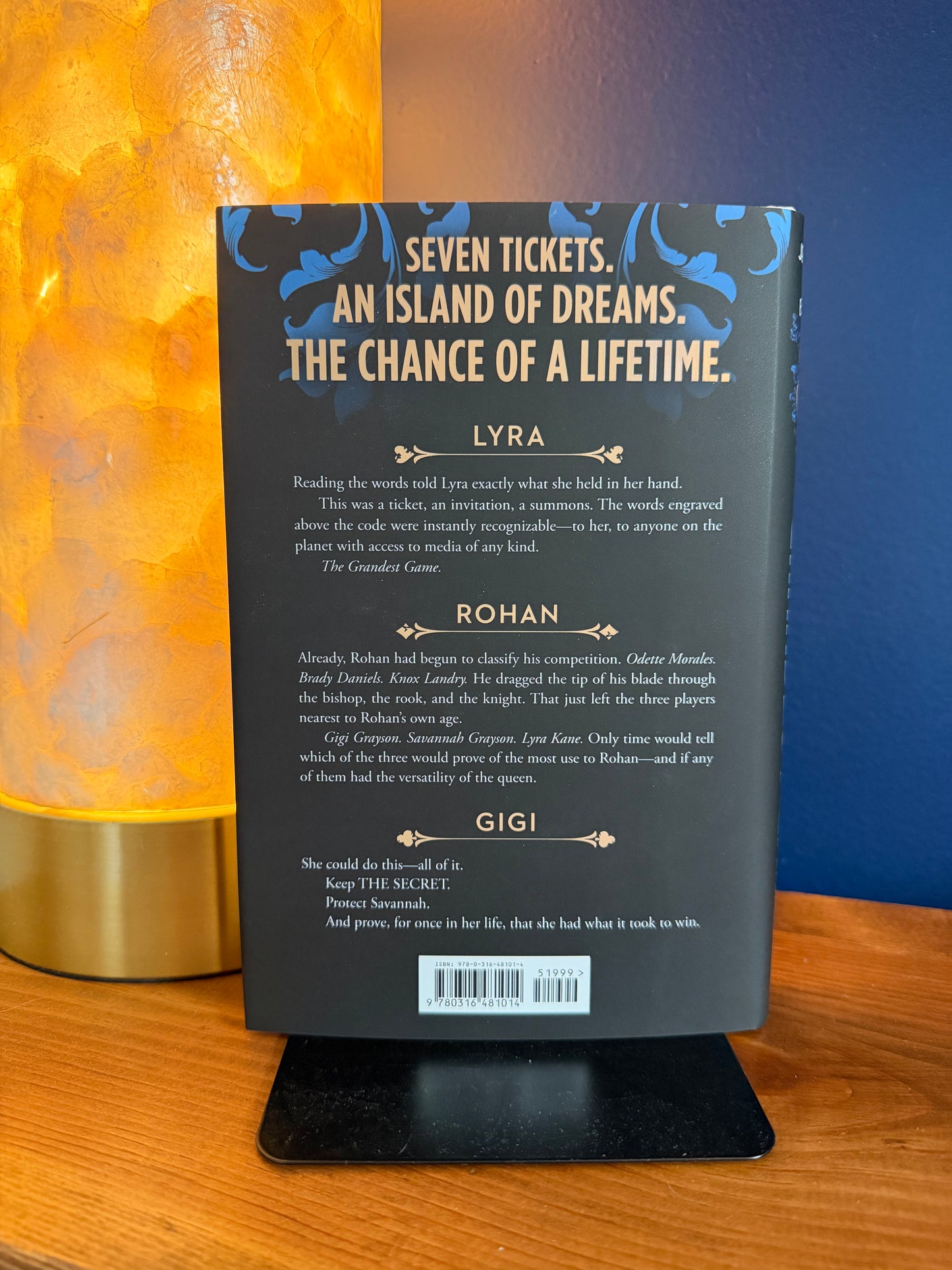 Book back cover with text on a stand against a blue and orange background